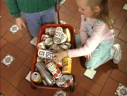 Girl-recycles-cans
