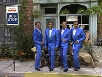 Standing at the Bus Stop Sign