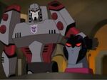 TFA Megatron smacks Starscream head