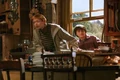 Fred Weasley and Harry Potter inside the Burrow.jpg