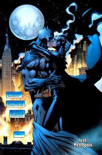 Batman and Catwoman kiss in front of the Gotham skyline