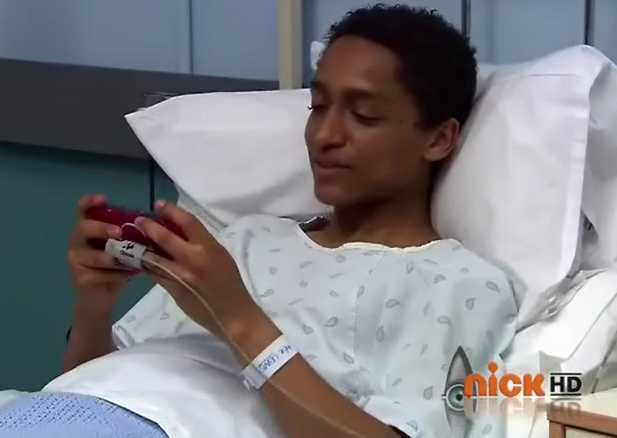 File:Alfie playing video games in te hospital bed.png
