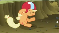Applejack taking cover from the derbis created by Rainbow Dash S2E03