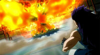 Natsu appears in front of Gajeel covered by his Flames
