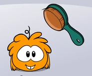 Orange puffle brush