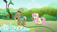 Mr. Greenhooves over watering Fluttershy's petunias S2E19