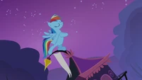 Rainbow standing on top of Rarity's tent S3E06