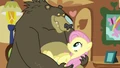 Grizzly bear holding Fluttershy S03E13.png