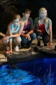 Mermaids Looking Into Moon Pool