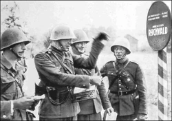 Polish officers discussing the next assault in the outskirts of a Czechoslovak village on October 9, 1938.