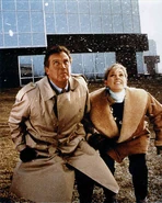 Steve Austin and Jaime Sommers escape captivity from the OSI grounds, by jumping over a wall.