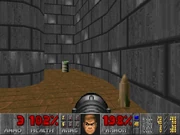 A rocket in the penultimate room of E1M5: Phobos Lab, in Doom, seen with the light amplification visor in effect.