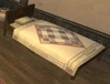 A mahogany bed in a mog house.