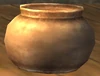 A Brass Flowerpot in a mog house.