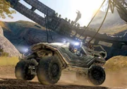 The Master Chief driving a Troop Transport Warthog.