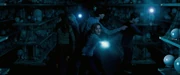 Fighting Death Eaters in the Hall of Prophecies.