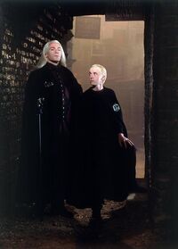 Lucius with his son in Knockturn Alley.