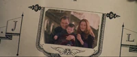 Harry as an infant with his parents.
