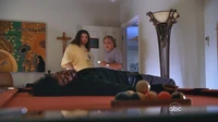 Hurley and David look at Sayid's unconscious body.
