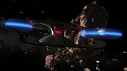 The Enterprise-D enters an asteroid field