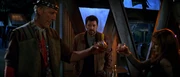 Troi and Cochrane share a drink