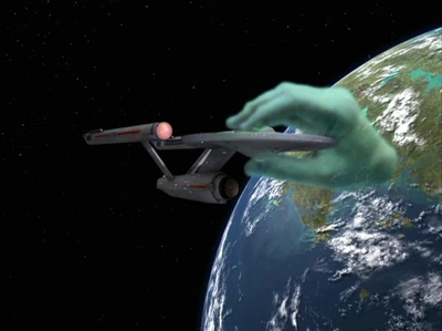 The USS Enterprise being held by Apollo's hand. (TOS: "Who Mourns for Adonais?" remastered)