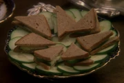 A plate of cucumber sandwiches
