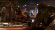 Patrons in the bar on Paradise City on Nimbus III having a game of water pool