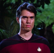 Captain Rice appears and asks Riker strange questions