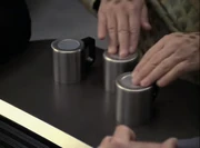 Neelix moving the cups while he demonstrates the shell game