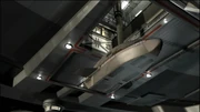 A shuttlepod connected to Enterprise's docking arm