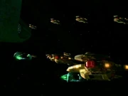 De gezamenlijke Cardassian-Romulan vloot gaat richting het wormgat