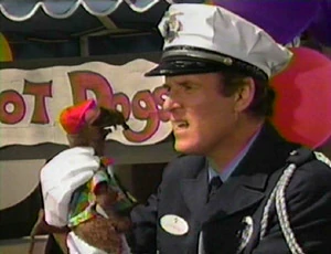 Quentin Fitzwaller interrogates Rizzo the Rat.