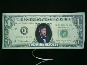 "Help" -- a metaphor for the means by which the dollar traps the individual, as seen in Time Piece