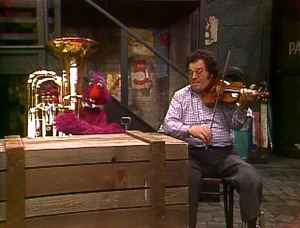 Perlman and Telly Monster play together.