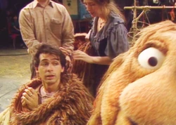 Rob Mills, crouching inside of Junior Gorg. Junior's head, with its "Gorg Vision" and facial mechanisms, rests beside him.