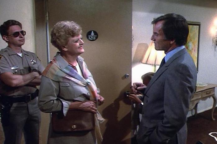 "Death Casts a Spell" screenshot with Angela Lansbury and Robert Hogan (right)