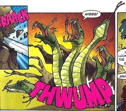 The serpent in pain after the tree falls on its back.