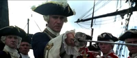 Commodore Norrington ordering Jack Sparrow to his feet.