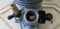 Slide carburetor mounted on a big block nitro engine