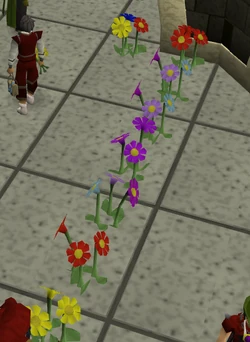 A row of players wielding flowers.
