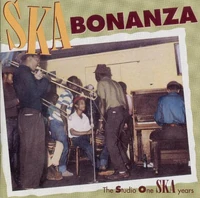 "Clement "Coxsone" Dodd leads a early rehersal of the Skatalites. Don Drummond and Rico Rodriguez are both on trombones" Cover of Heartbeat CD HB 86/87
