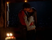Lana gives Clark a birthday kiss.
