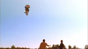 Unable to control his powers, Clark sends a tractor soaring.