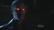 The Martian Manhunter's eyes glow red.
