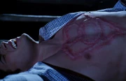 When he resists, Jor-El sears the sign of their ancestors on Clark's chest.