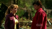 Lois and Clark walking up to the dam.