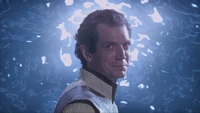 Janus smiles back at Dr. Weir as he steps through the Stargate.