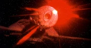 Cloaked Klingon ship firing torpedo