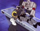 Bombshell copping a feel on Nightbird.  It must get lonely with all the fembots being Autobots.